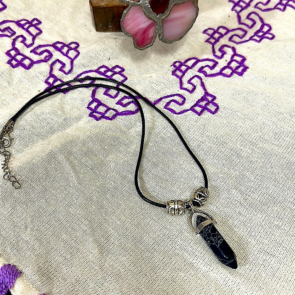 This black stone with white swirls is highly blessed